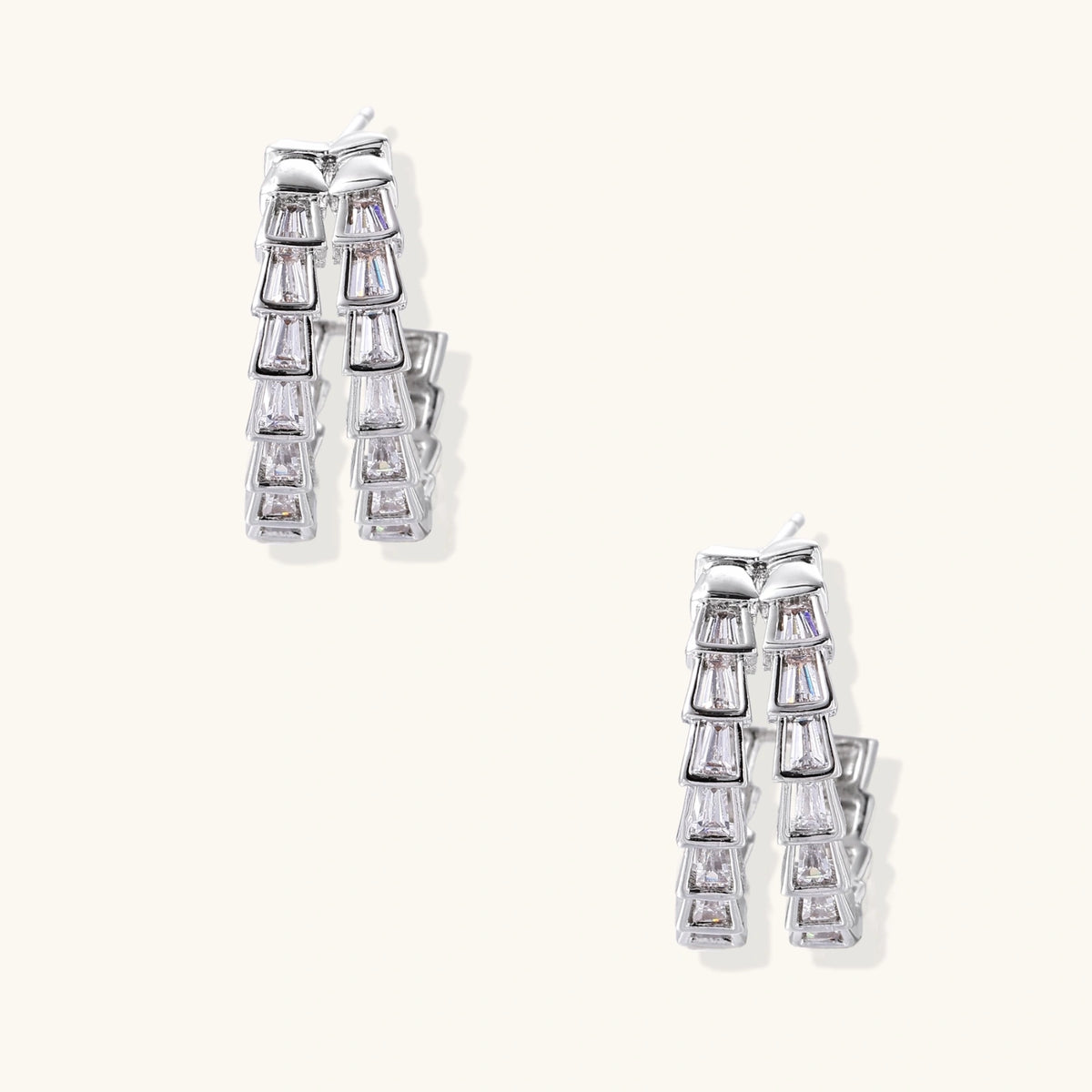 White gold-plated hoop earrings with double row of baguette-cut zirconia stones in geometric ladder design
